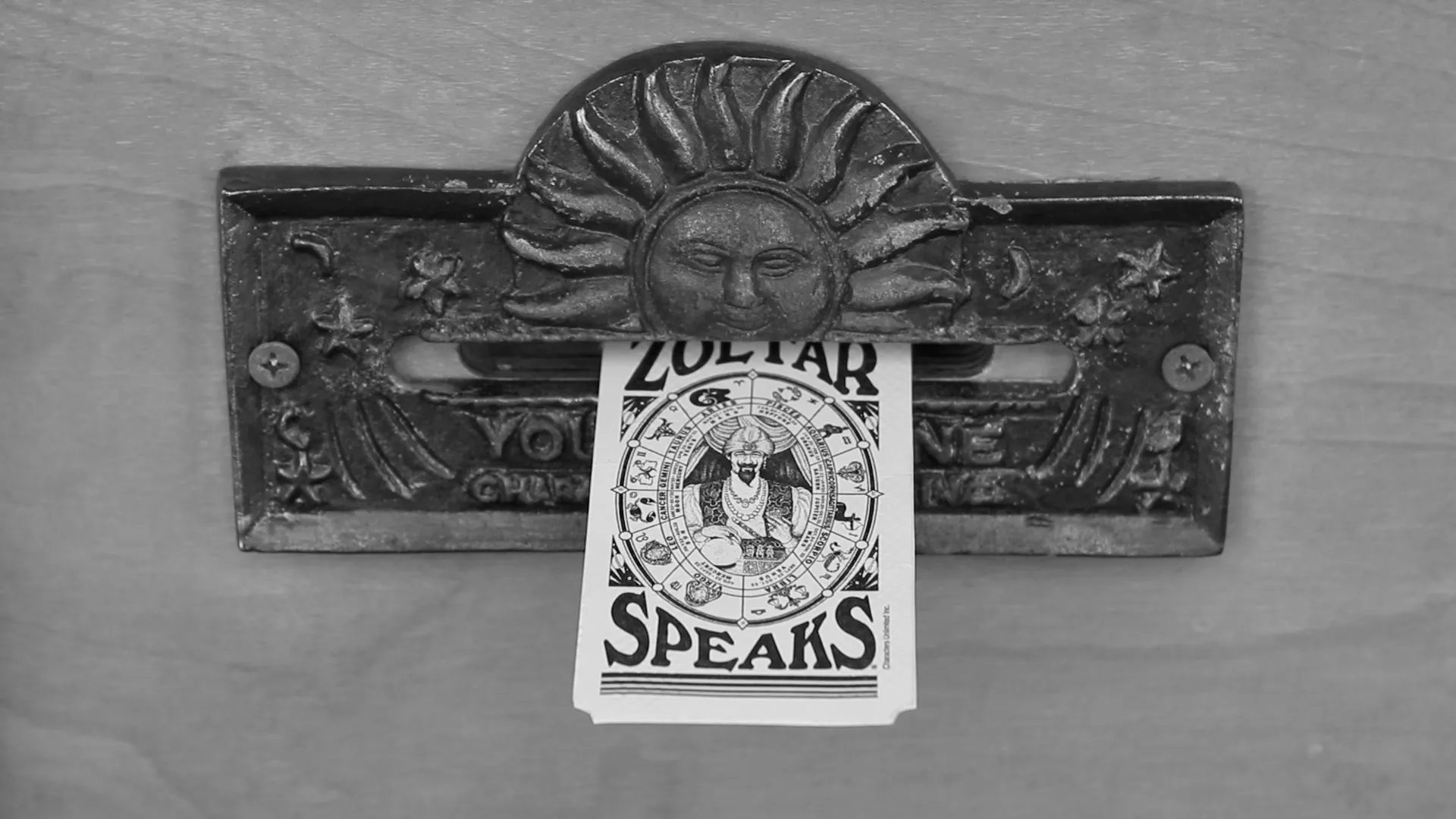 Filmstill - A closup of a ZOLTAR fortune ticket